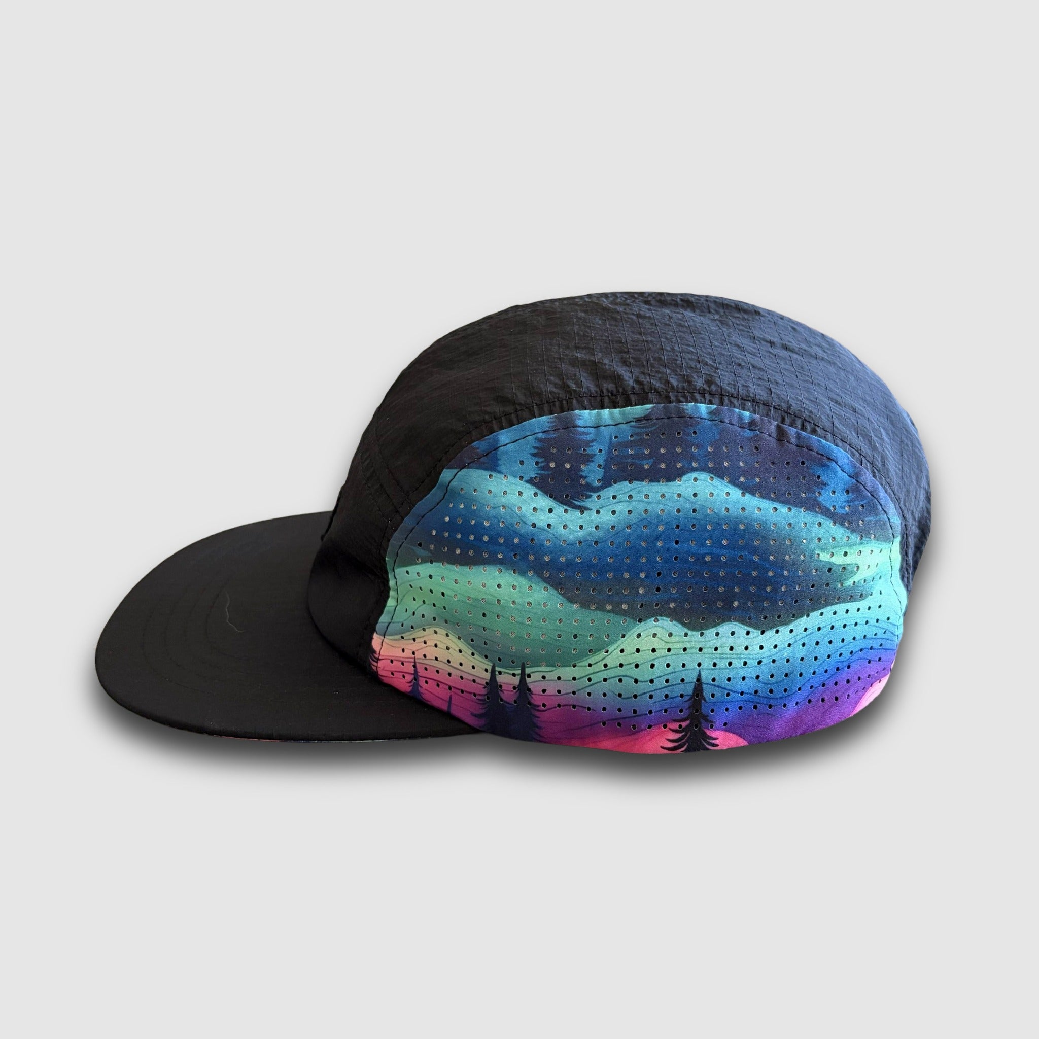 Colorful cap with mountain design on a light gray background