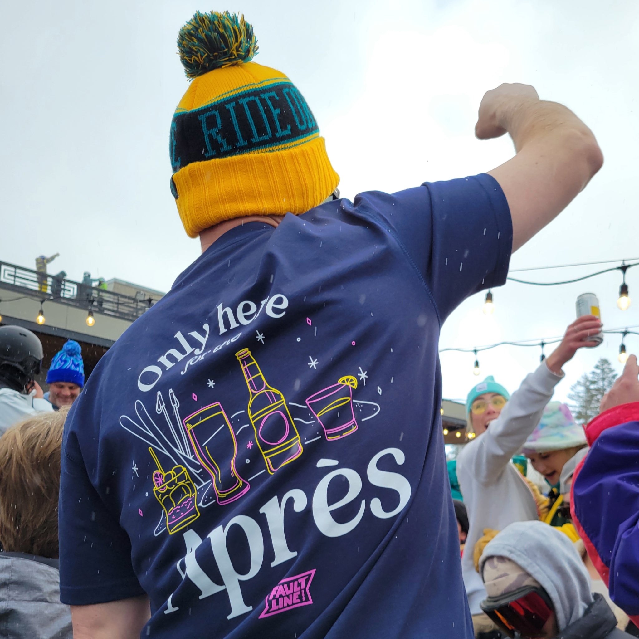 Model wearing the Navy Après Tee, highlighting its comfortable design and casual style for ski resort adventures.