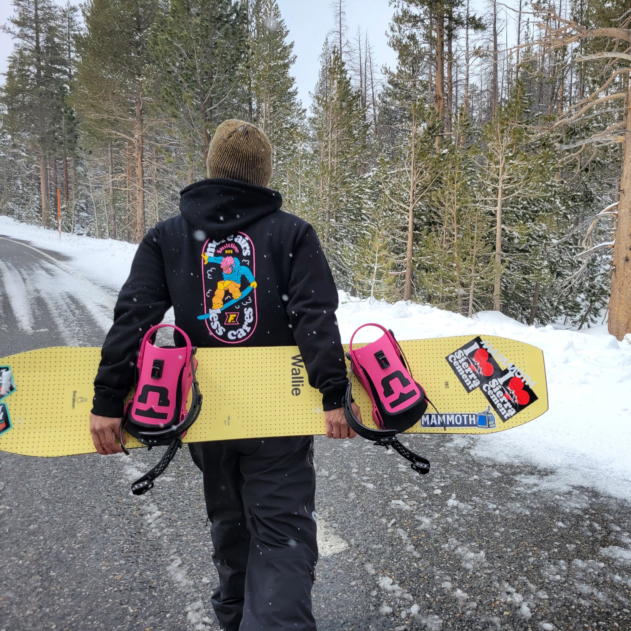 Snowboarder wearing the More Airs, Less Cares heavyweight hoodie