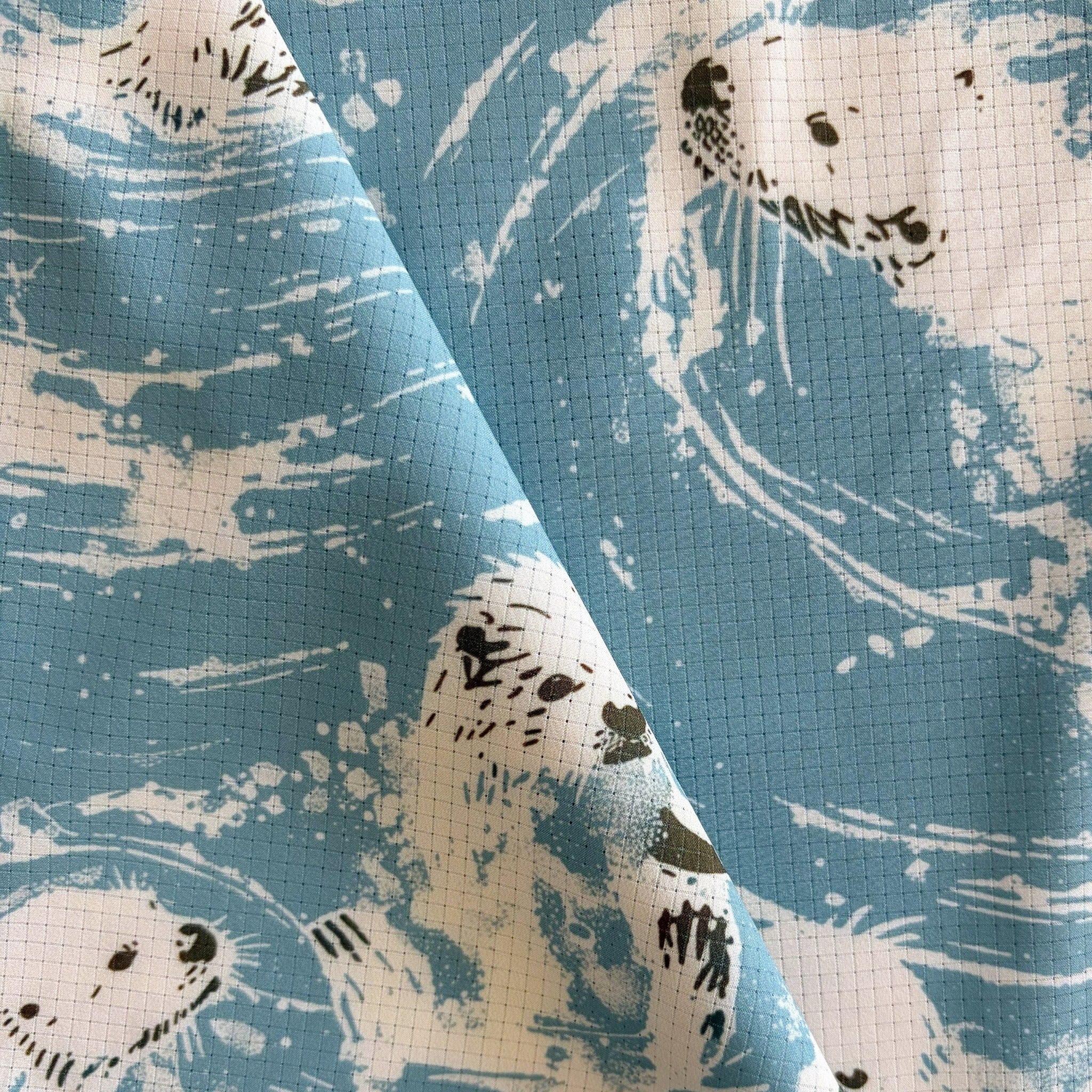 Close-up of the light blue fabric with sea otter pattern used on the Langley shirt from FaultLine395