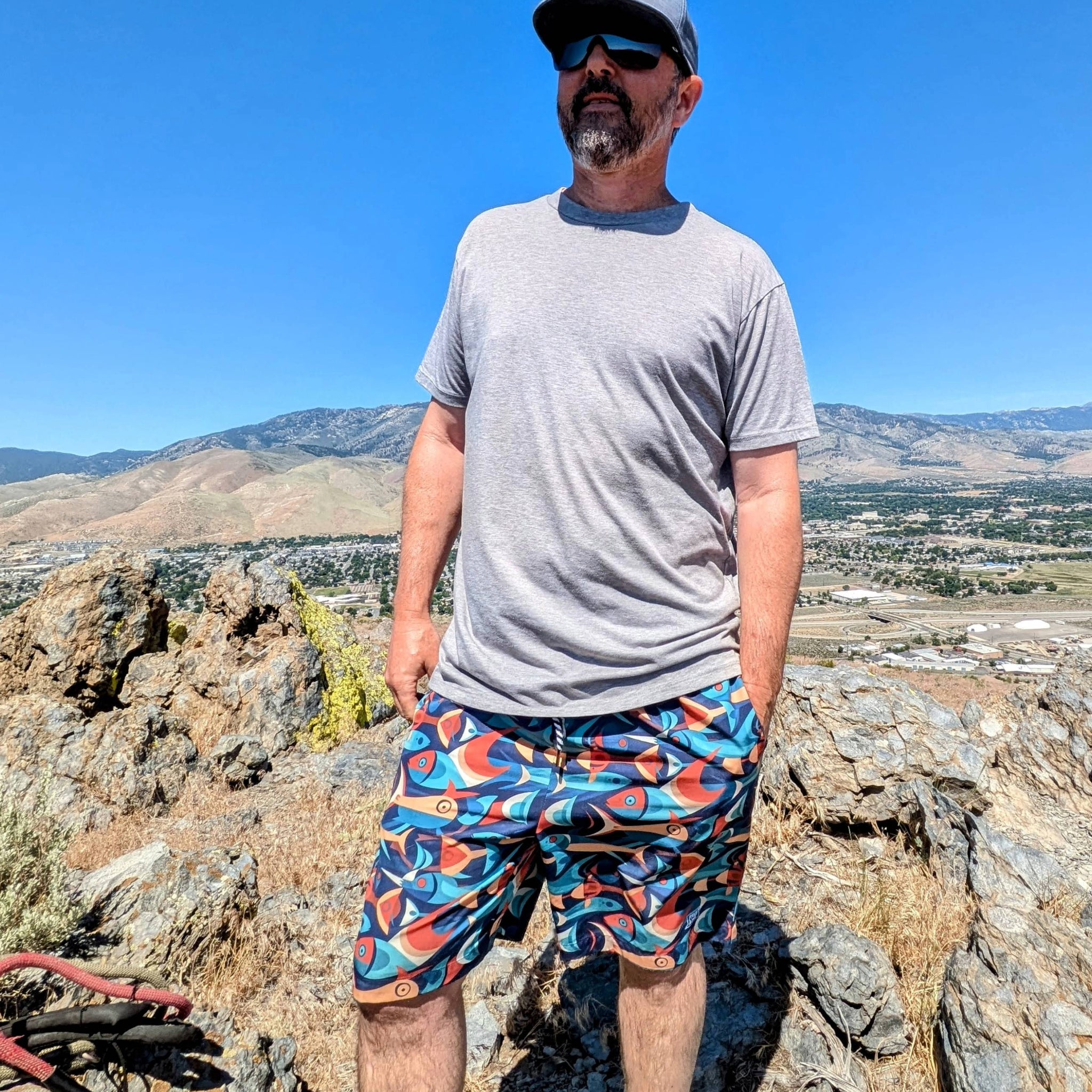 Hiker wearing the Crowley Tech Shorts showcasing the performance and knee length design.