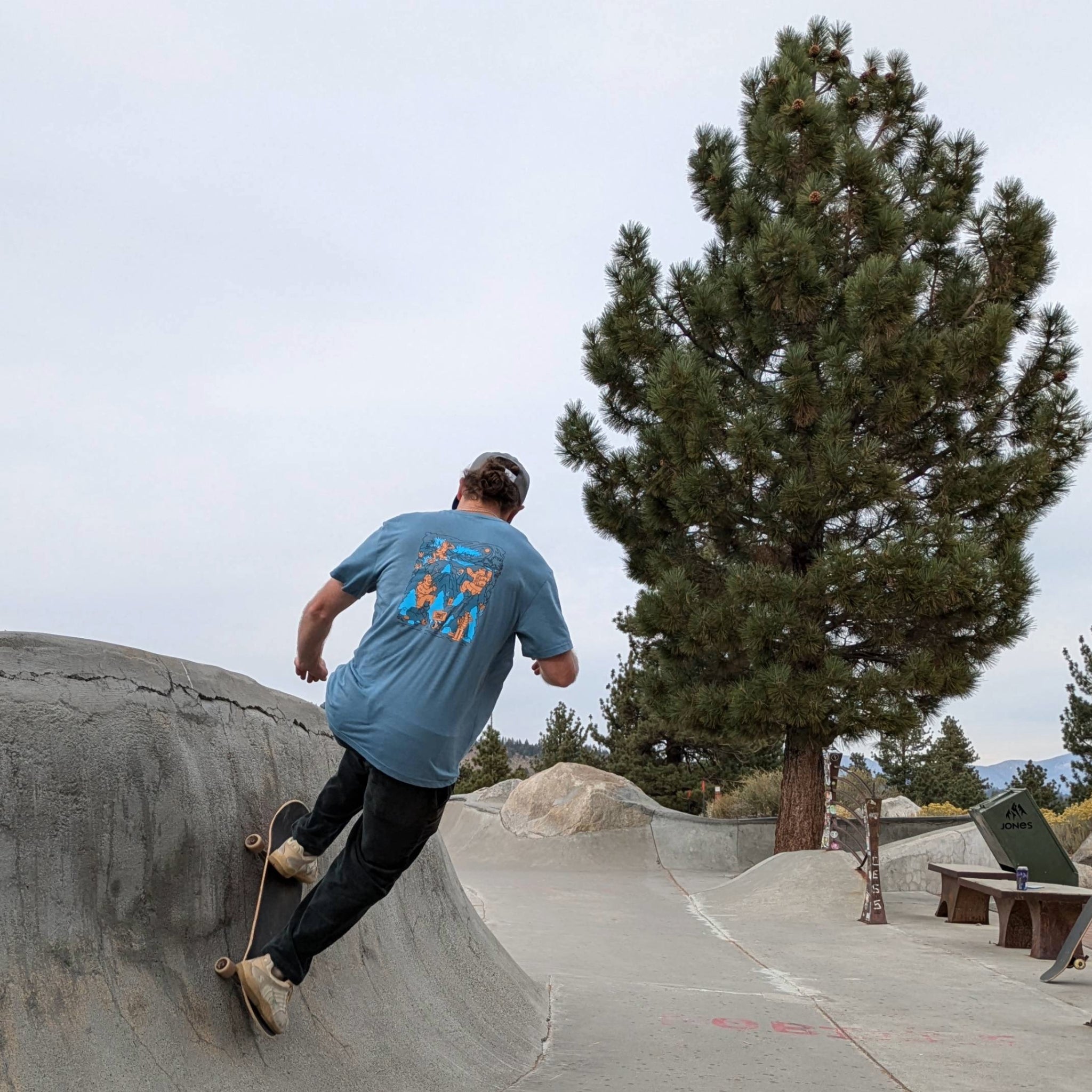 Skateboarder demonstrating the breathability and performance of the Wild Friends eco-friendly tee