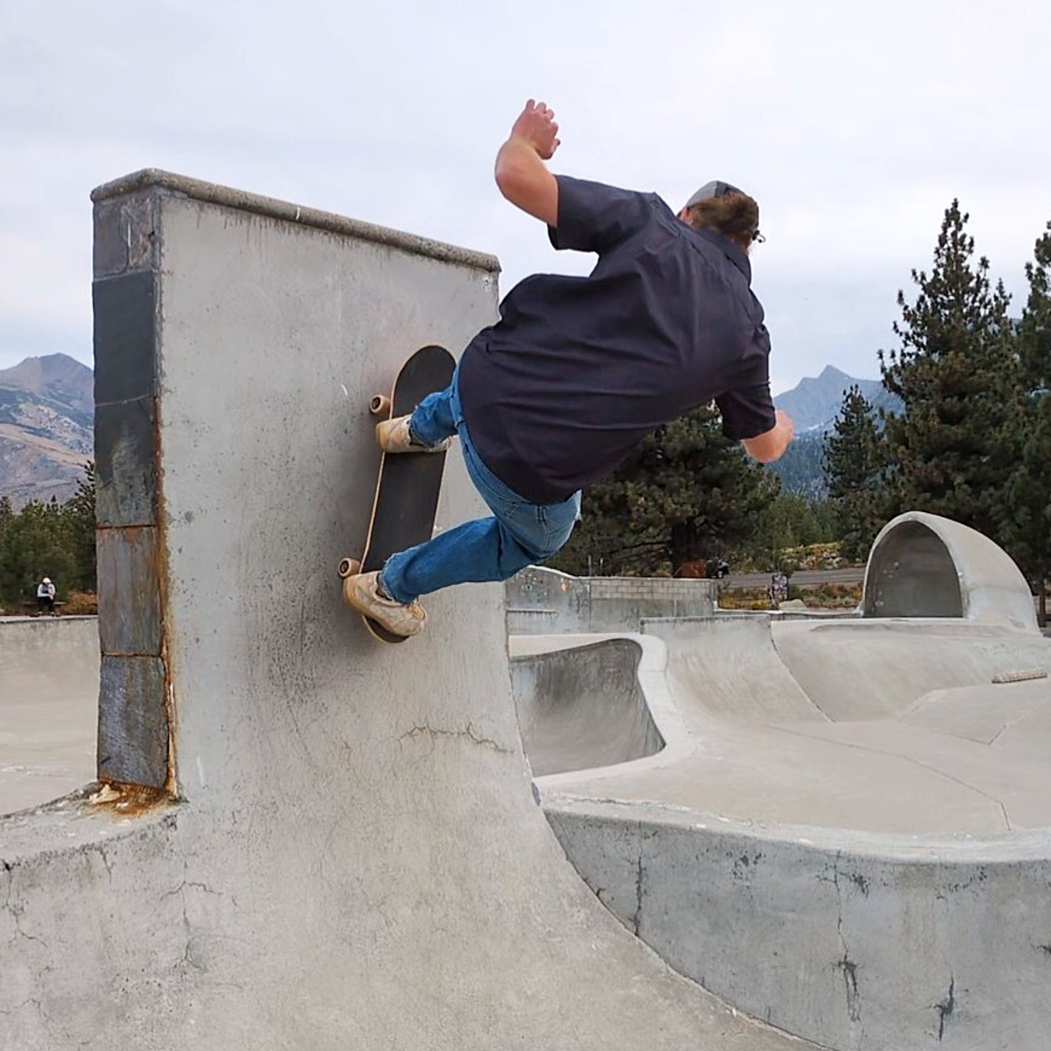 Skateboarder demonstrating the stretch and breathability of the Langley Button Up shirt from Faultline395