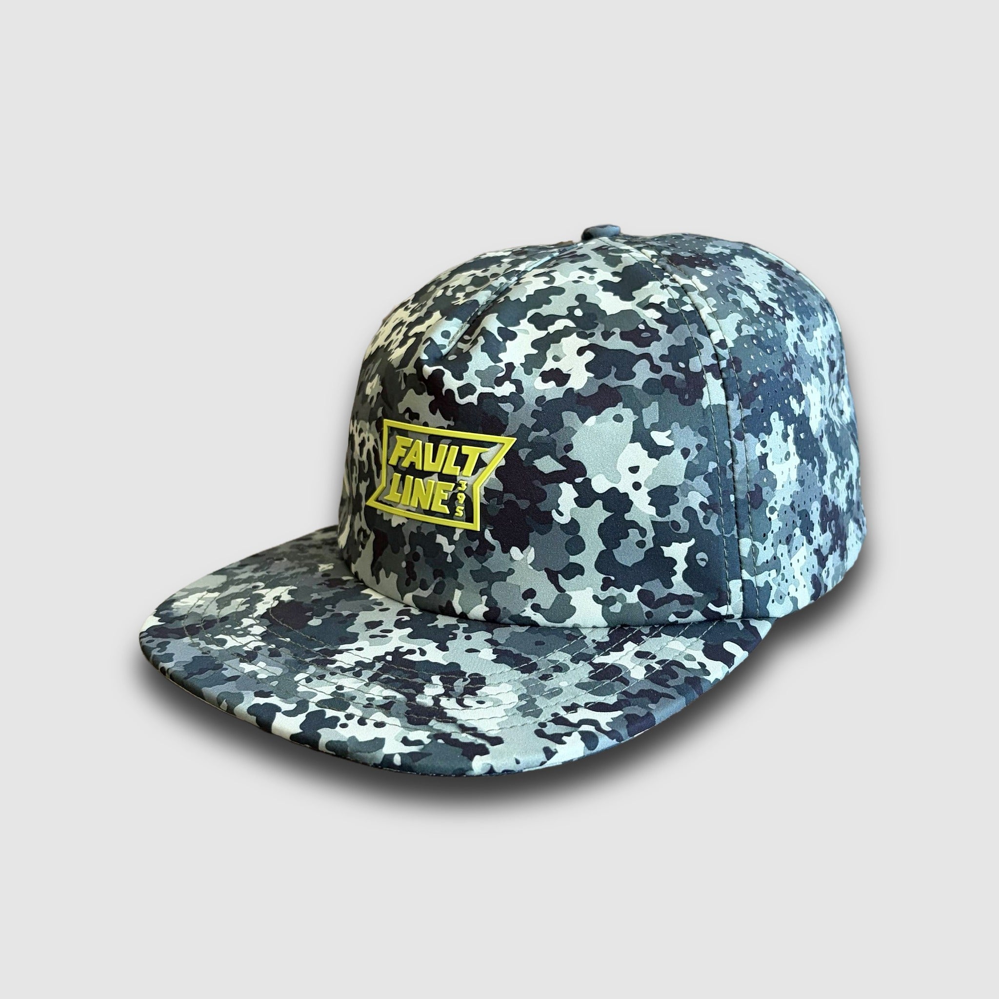 Camouflage cap with a yellow Faultline395 logo and ventilation holes