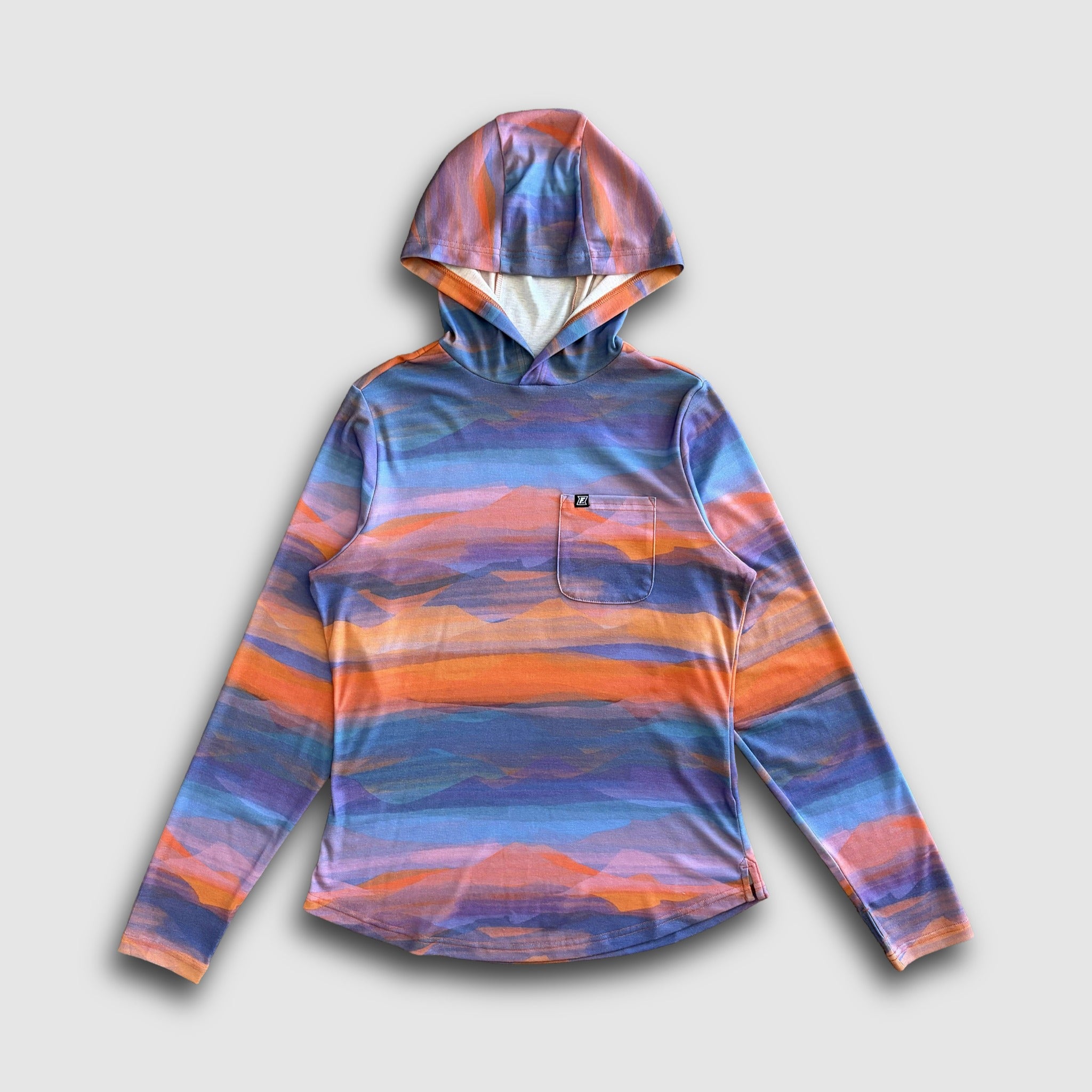 Colorful mountain design on a sun hoodie against a light grey background