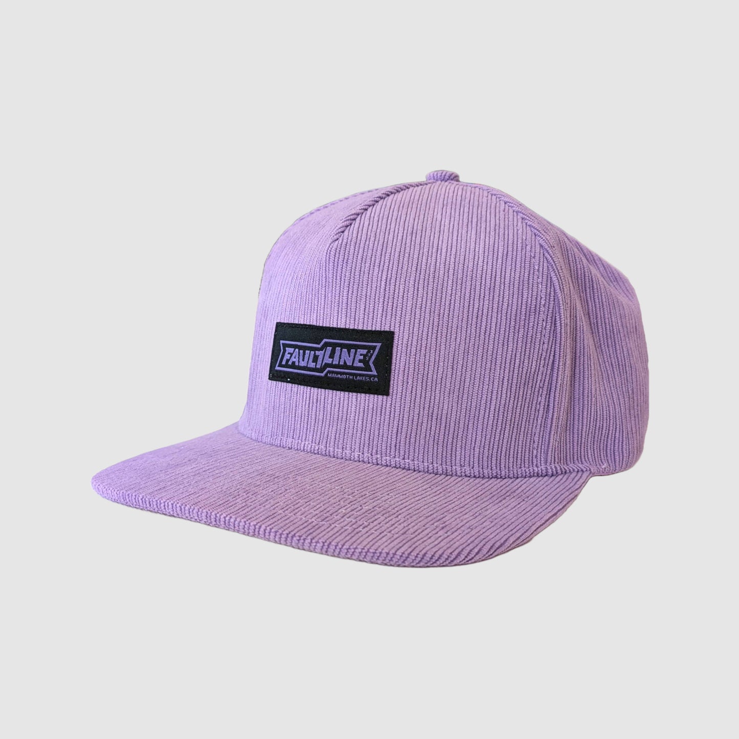 Diagonal view of our stylish lilac snapback featuring soft corduroy texture and adjustable strap