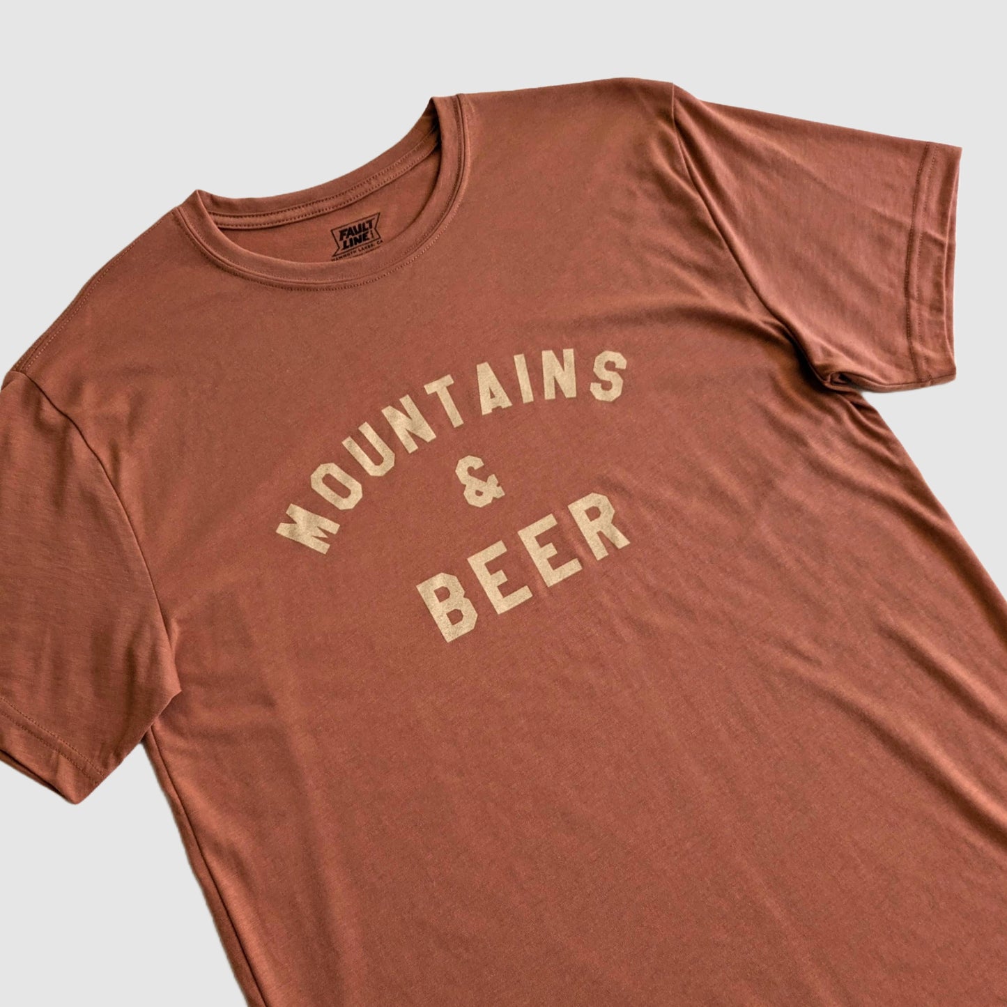 Detailed view of our eco-friendly t-shirt with a Mountains and Beer screen printed design on the front