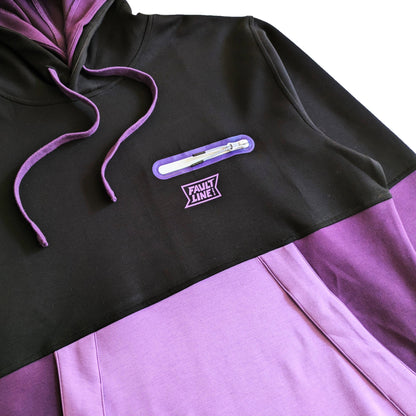 Close-up of Faultline395 logo and waterproof zip chest pocket on the Cloud 9 Double Hoodie, highlighting quality