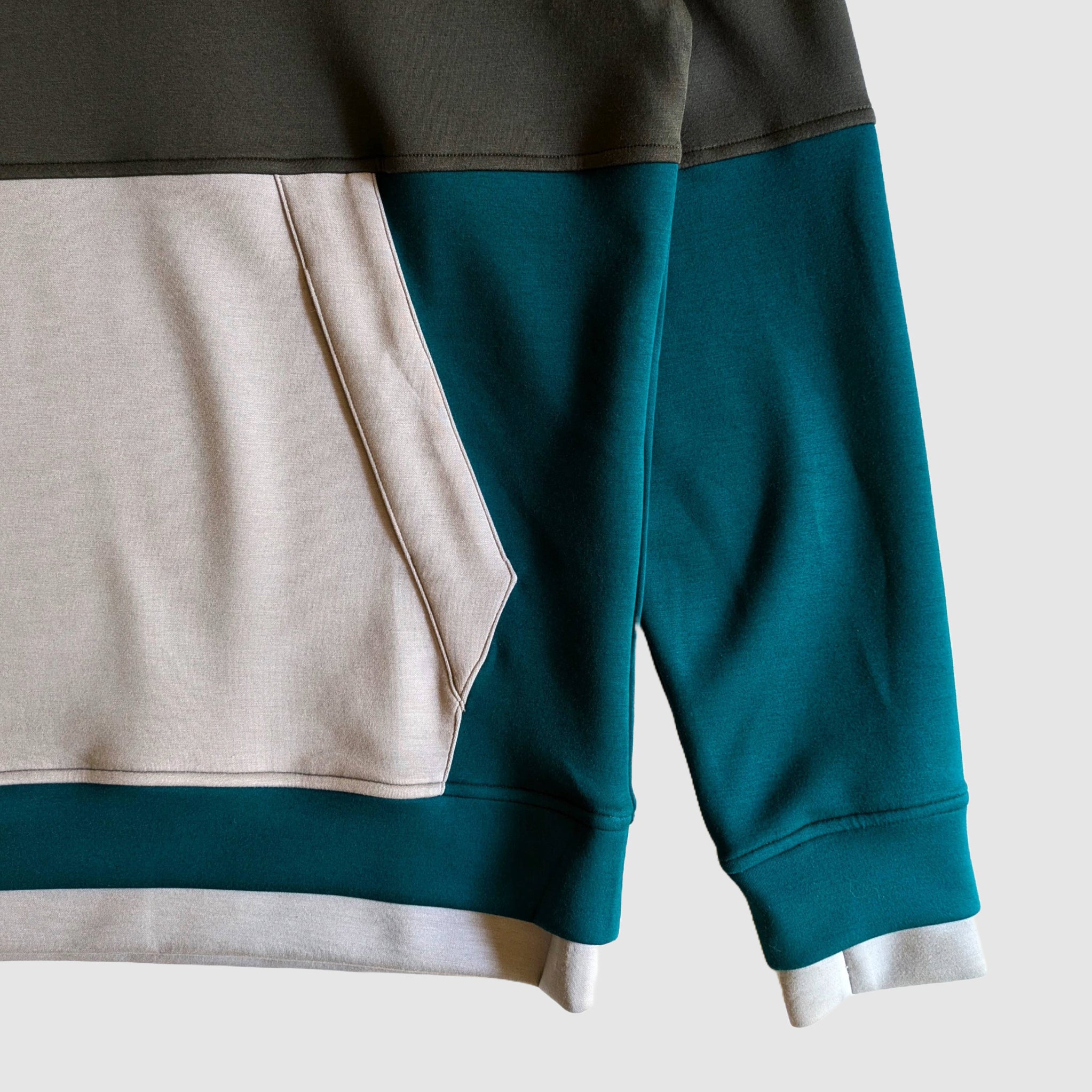 Detail shot of the Could 9 Hoodie showing the unique graphite, teal, and gray colorway