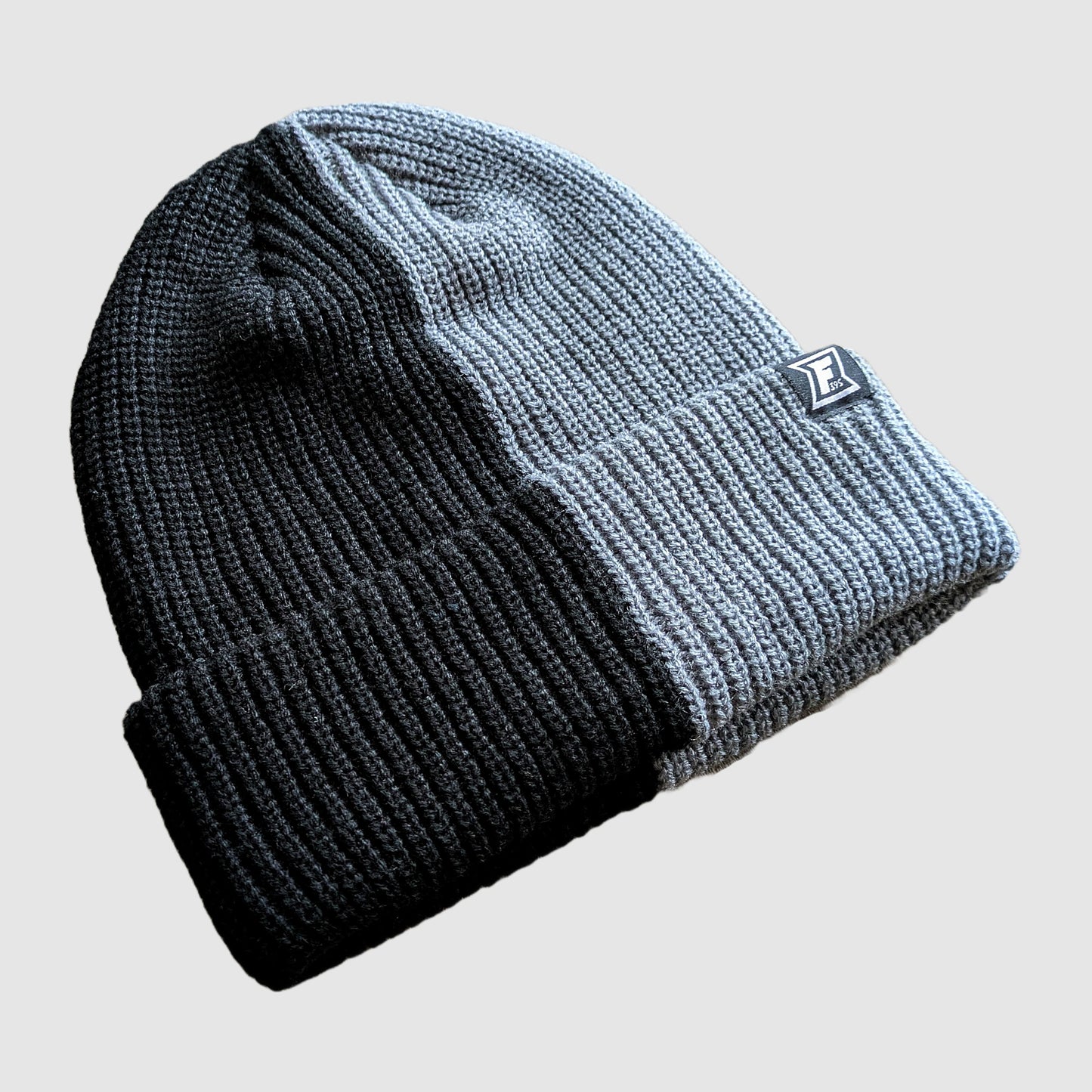 Half black and half grey beanie from Fault Line 395.