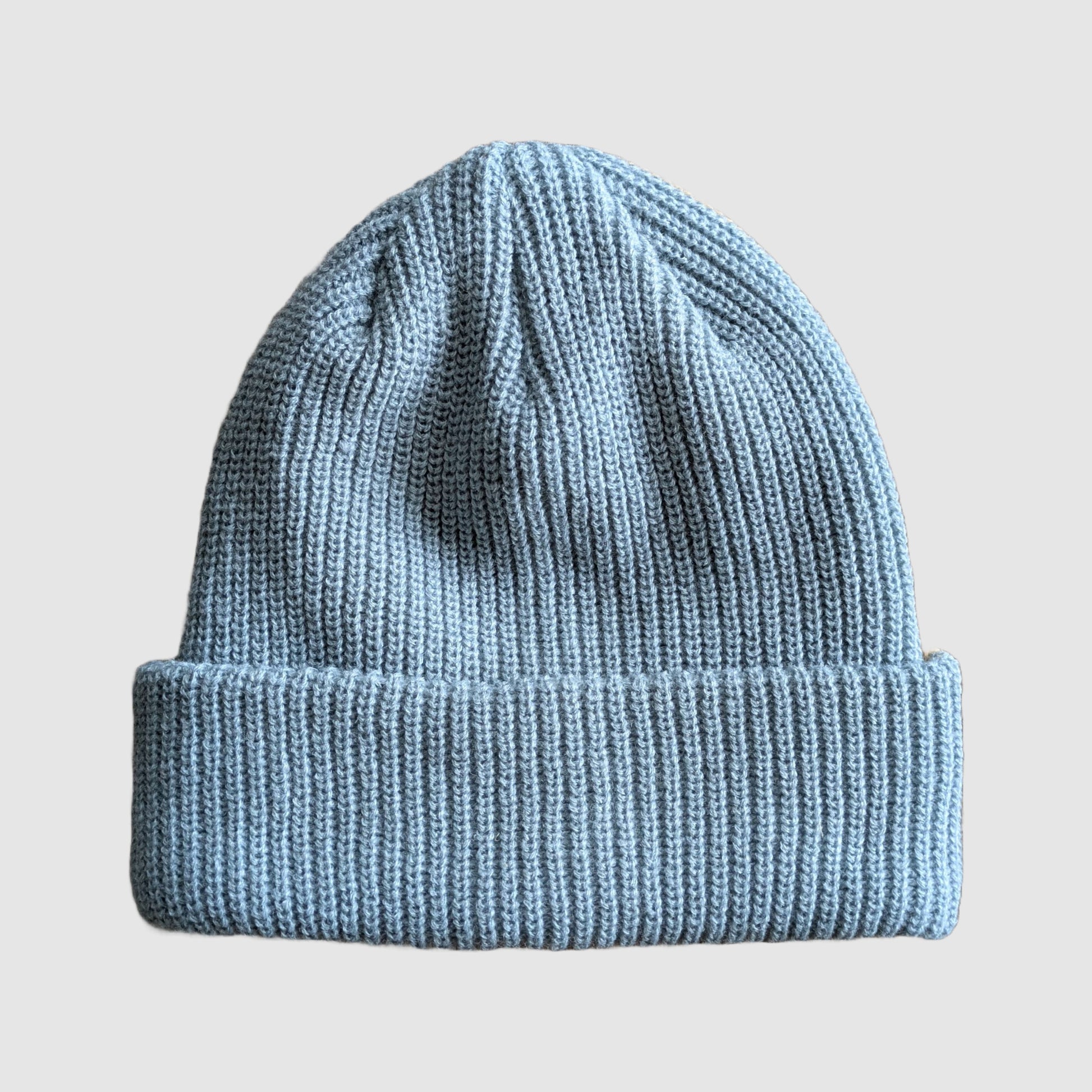 Shot of the light blue side of the tan and blue 2Tone beanie from Faultline395.