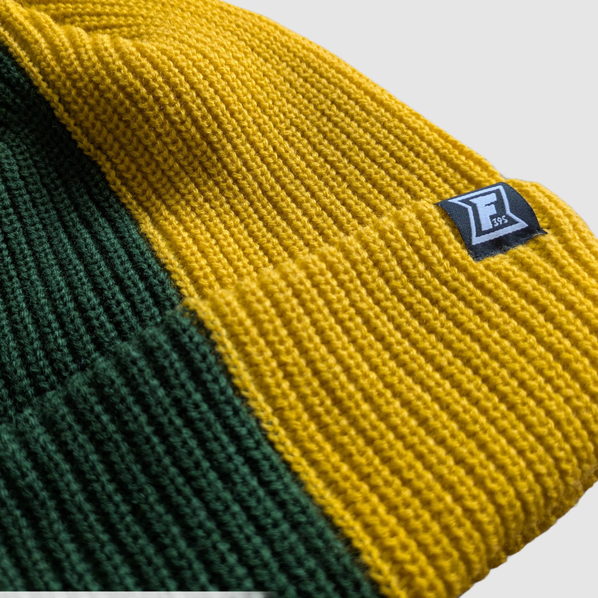 Close up of the Faultline395 logo label on our 2-Tone beanie.