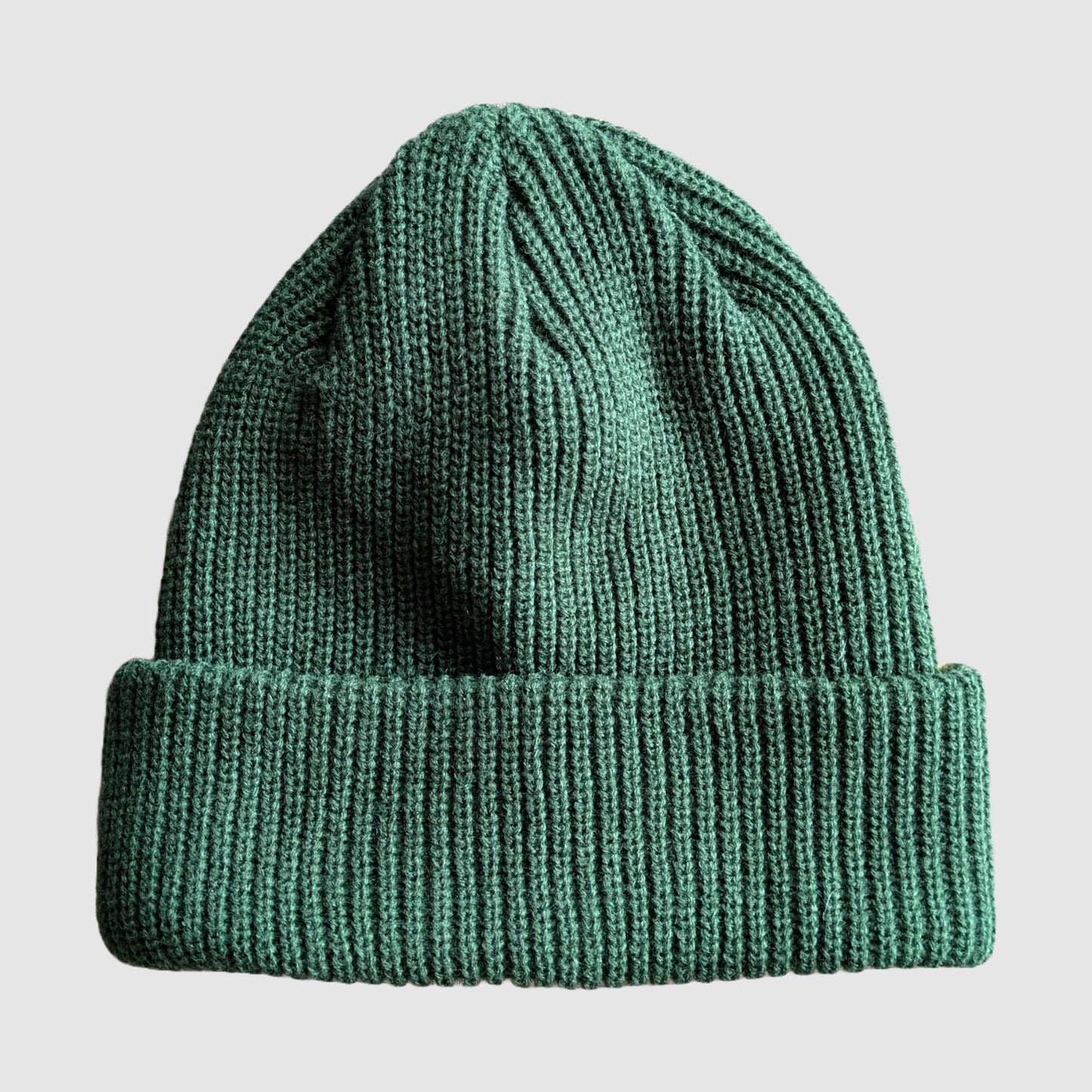 Shot of the green half of the two-tone beanie from Fautline395 in green and yellow.