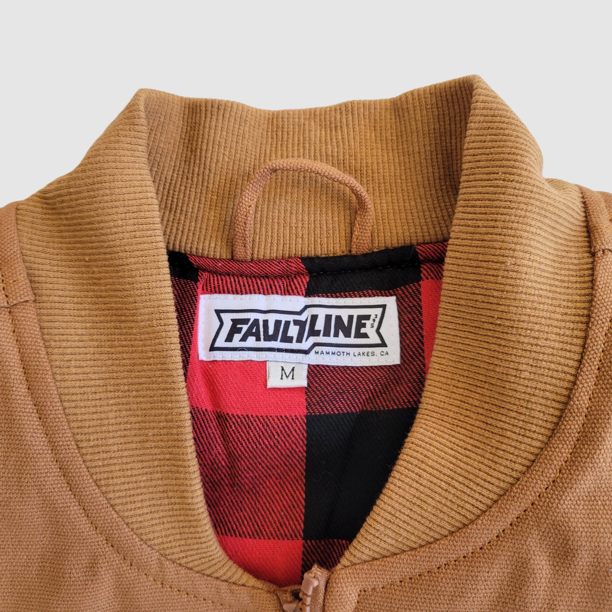 Detail photo of the soft rib-knit collar on the Fault Line 395 work vest.