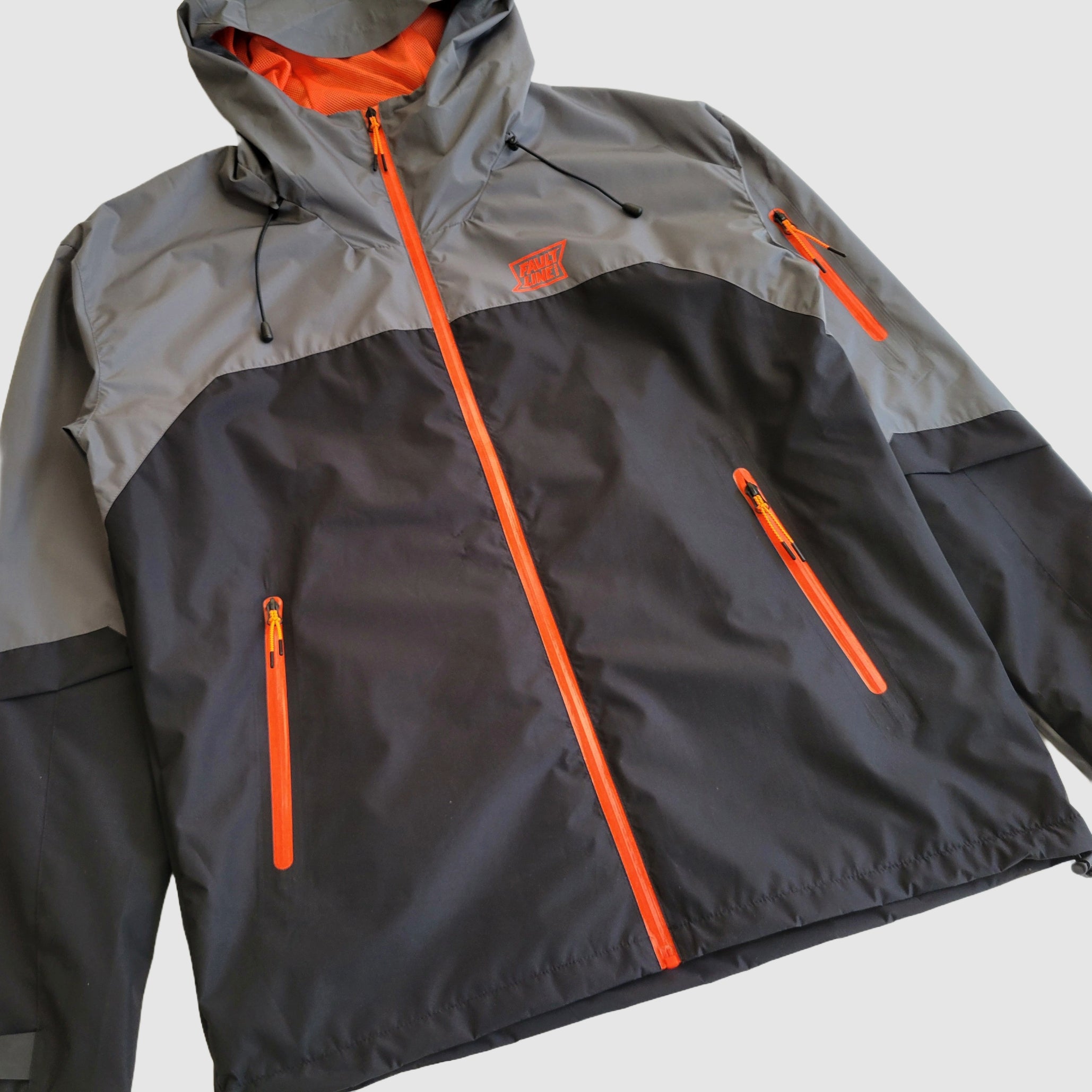 Angled view of Faultline395's Forest Trail Jacket, highlighting its sleek silhouette and breathable fabric.