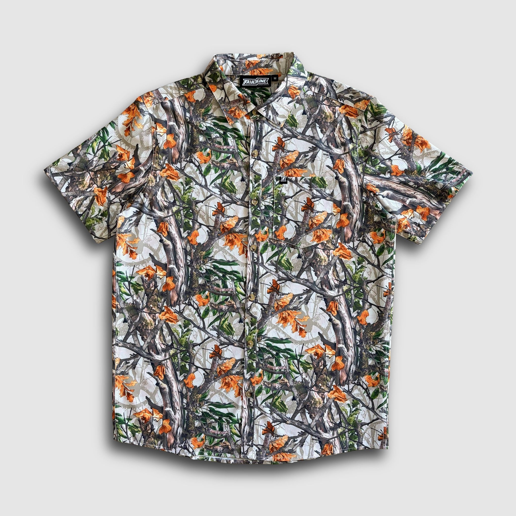 Short-sleeve shirt with nature-themed camouflage pattern on a light gray background