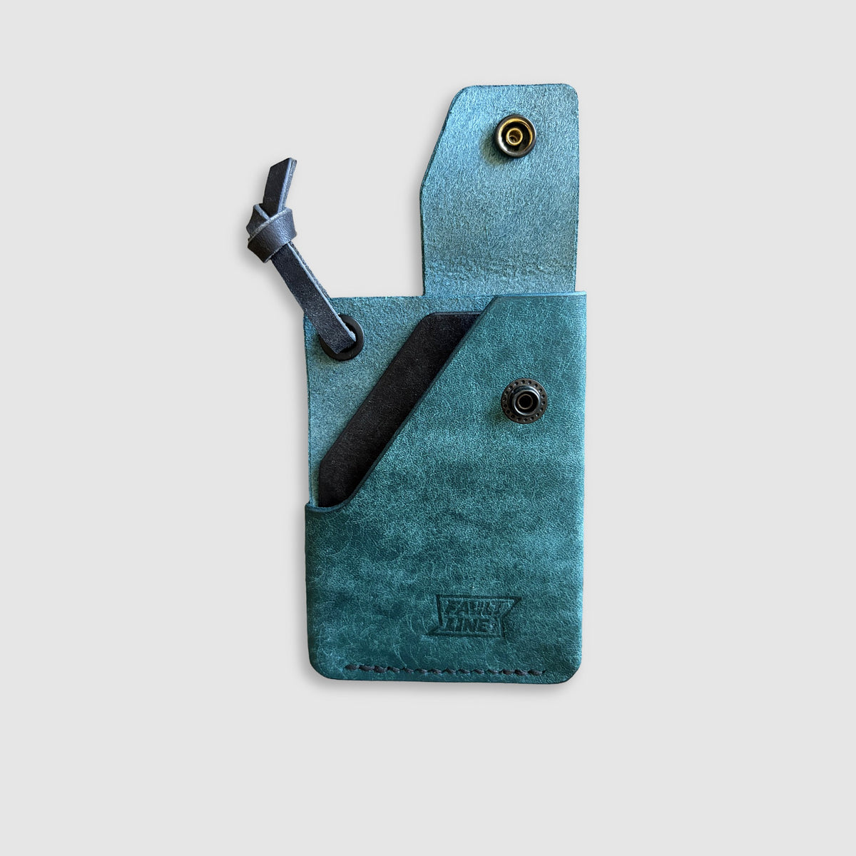 A teal blue leather wallet with a black leather strap. The brand name 'FaultLine395' is embossed on the bottom.
