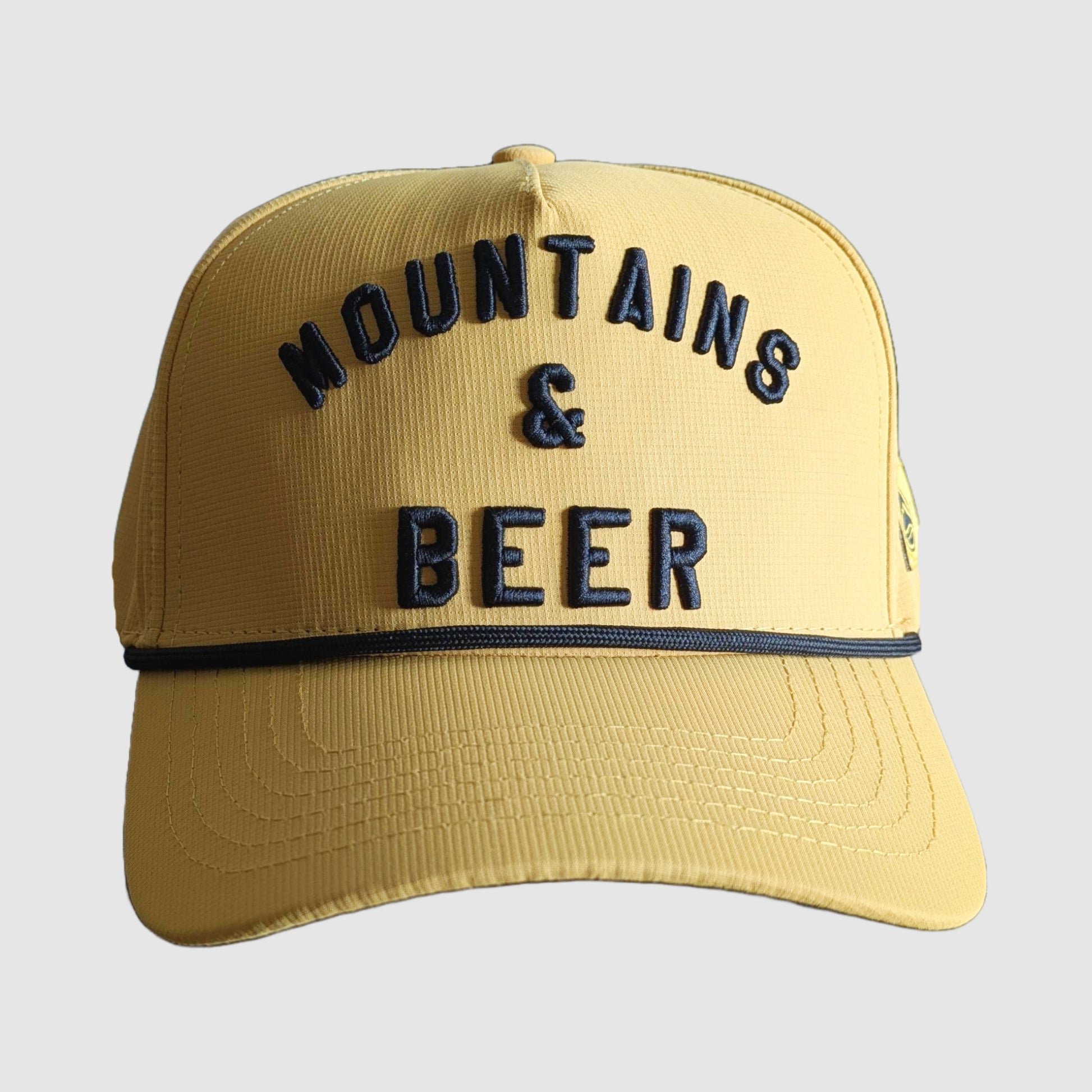 Front view of the yellow Mountains and Beer snapback hat.