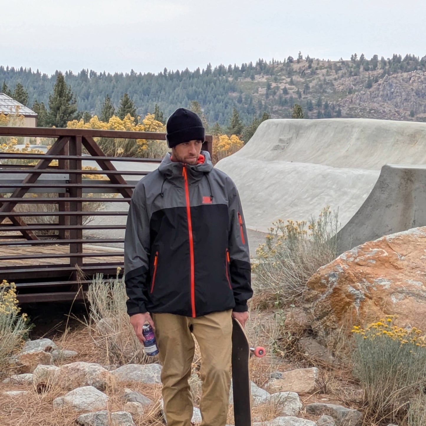 Skateboarder wearing the Forest Trail Jacket in Black and Grey, showing off its comfort and versatility.